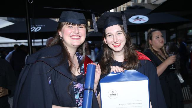 Caitlyn Fouche and Tegan Benham-Bannon celebrate graduation. Picture: Alan Barber