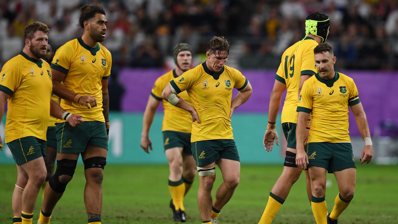 Australia's players react after England beat the Wallabies to dump them out of the World Cup.