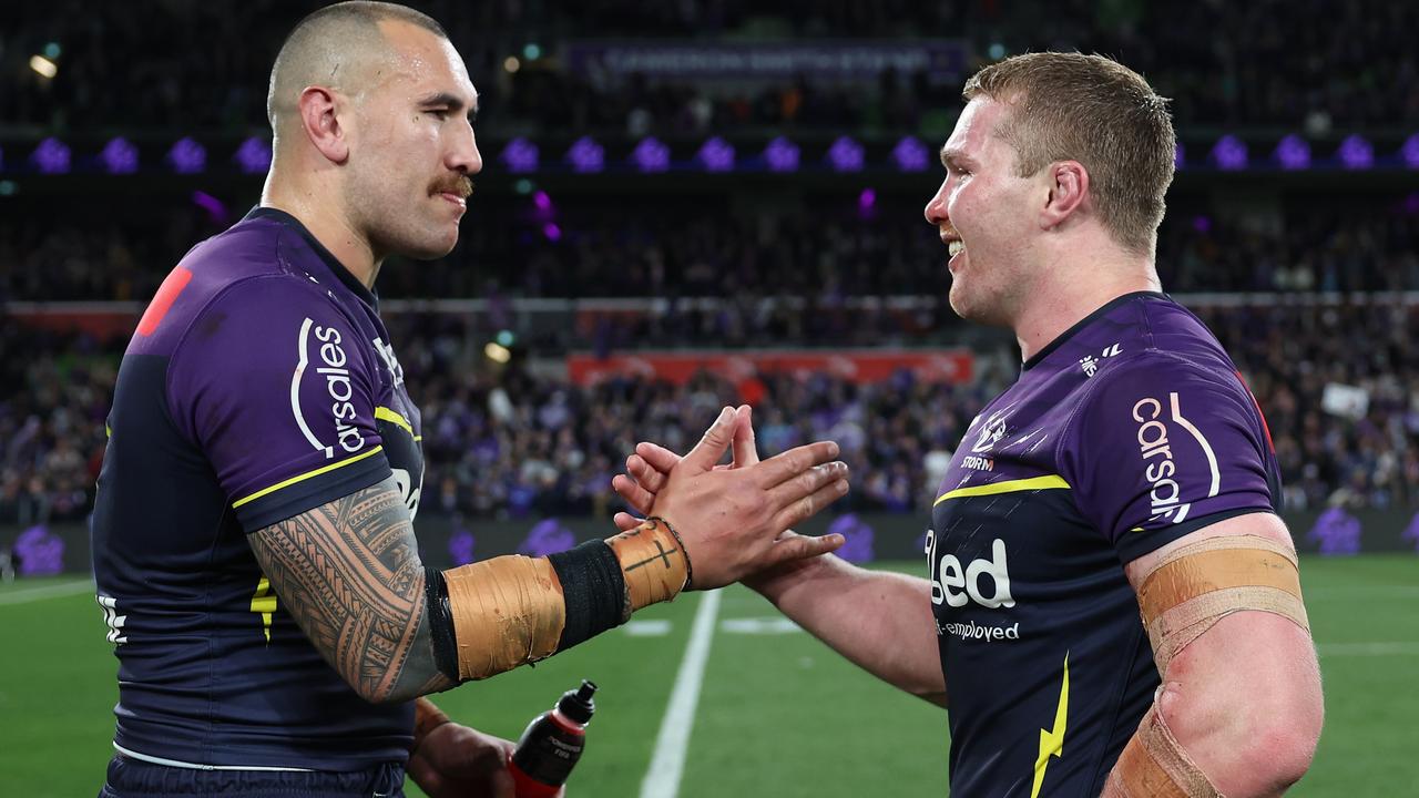 MELBOURNE, AUSTRALIA - SEPTEMBER 27: Nelson Asofa-Solomona and Josh King of the Storm celebrate winning the NRL Preliminary Final match between the Melbourne Storm and Sydney Roosters at AAMI Park on September 27, 2024 in Melbourne, Australia. (Photo by Cameron Spencer/Getty Images)