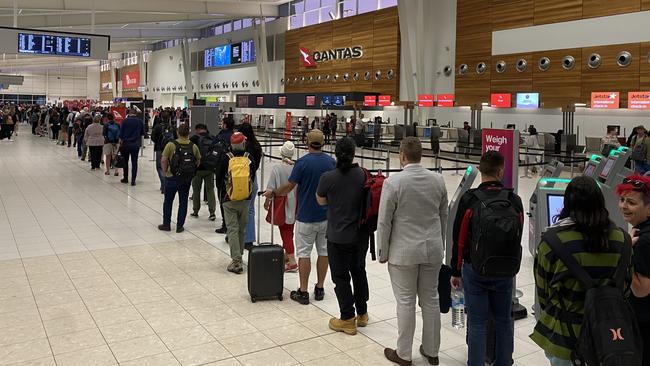 Travelling interstate – long queues at Adelaide Airport. Picture: Kathryn Bermingham