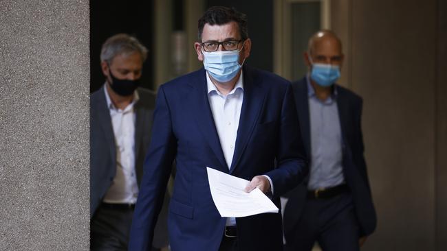 Daniel Andrews, pictured on Wednesday with chief health officer Brett Sutton and Covid-19 Commander Jeroen Weimar, has long pushed an eradication strategy. Picture: Getty Images