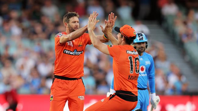 Andrew Tye celebrates a wicket with Scorchers teammate Mitch Marsh.