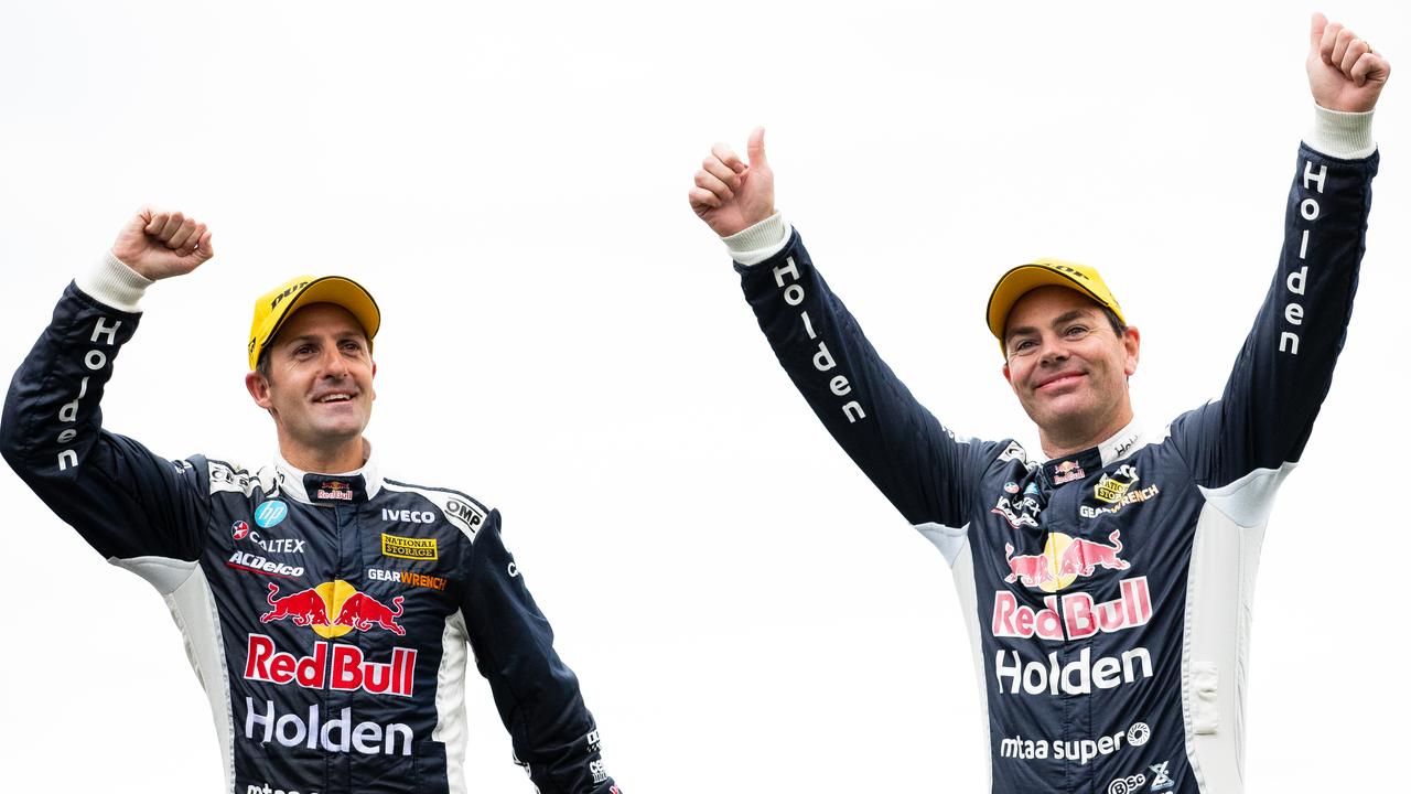 Jamie Whincup and Craig Lowndes celebrate after winning the Sandown 500. Picture: Daniel Kalisz