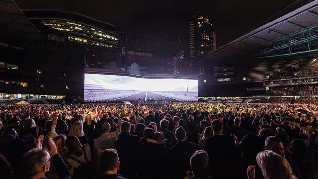 Bono sings to a packed stadium. Picture: Jason Edwards