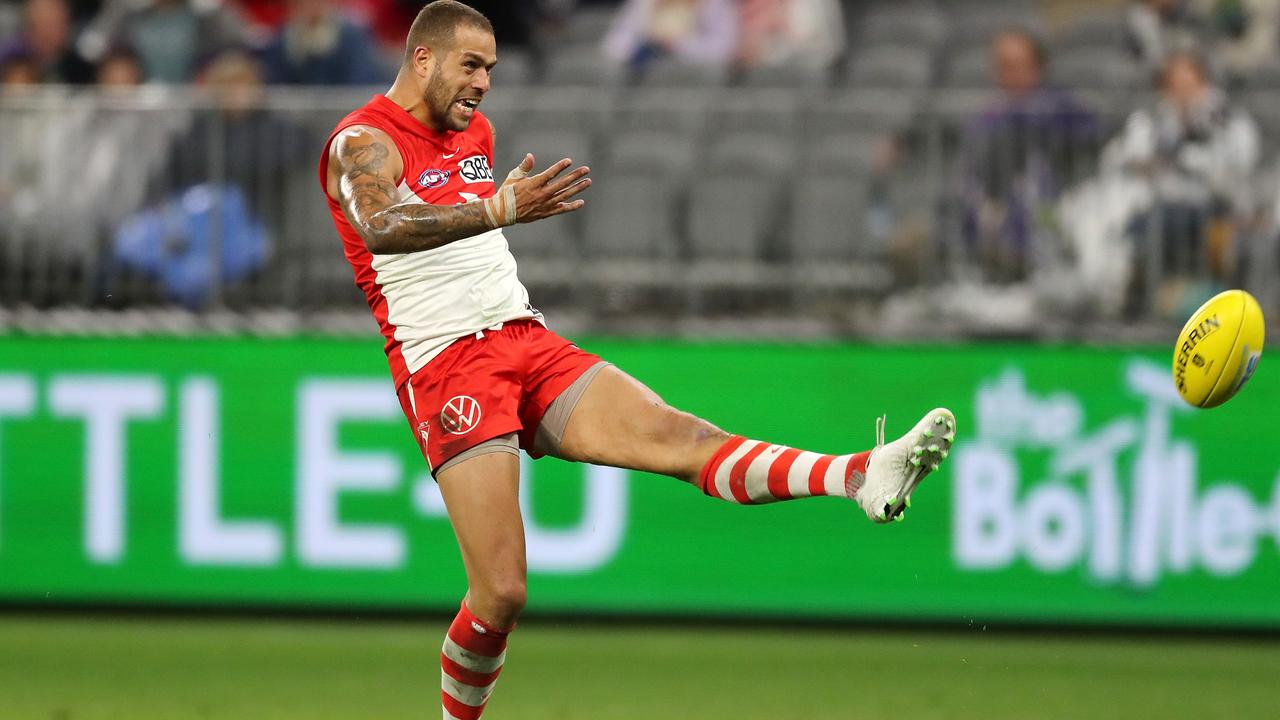 Lance Franklin launches a trademark long goal.