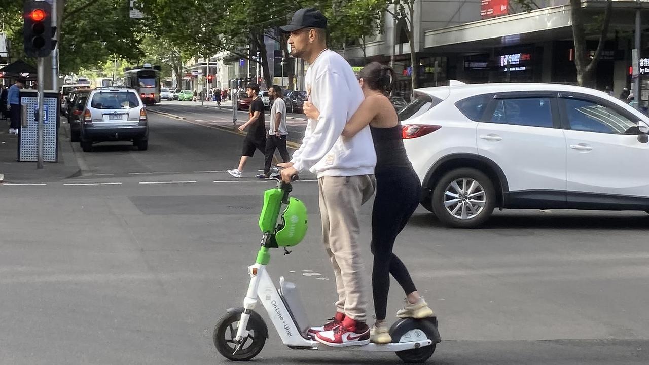Australian tennis player Nick Kyrgios riding a e-scooter on Elizabeth street in Melbourne, Sunday, January 15, 2023. (AAP Image/James Ross) NO ARCHIVING