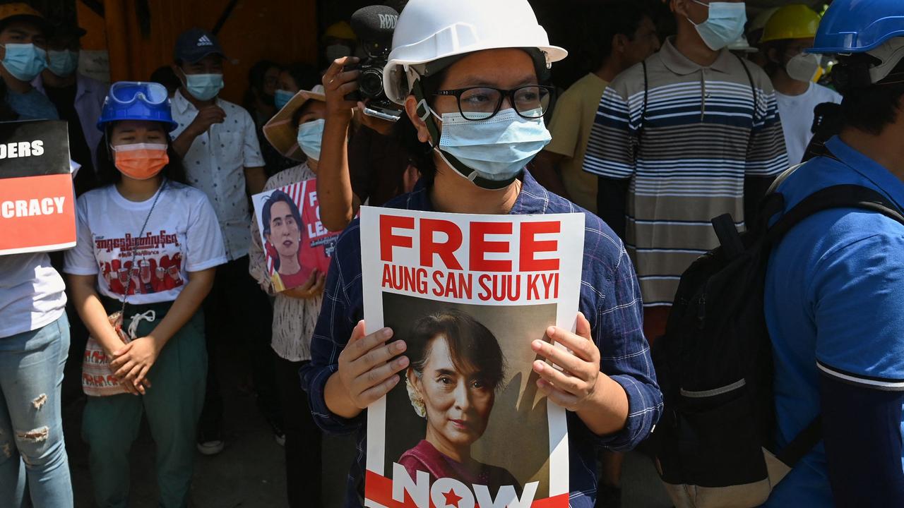 A protester holds a sign calling for the release of detained Myanmar civilian leader Aung San Suu Kyi. Picture: STR/AFP