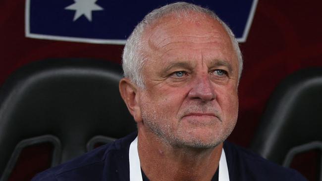 Australia's coach Graham Arnold takes his seat for the FIFA World Cup 2022 inter-confederation play-offs match between Australia and Peru on June 13, 2022, at the Ahmed bin Ali Stadium in the Qatari city of Ar-Rayyan. (Photo by MUSTAFA ABUMUNES / AFP)