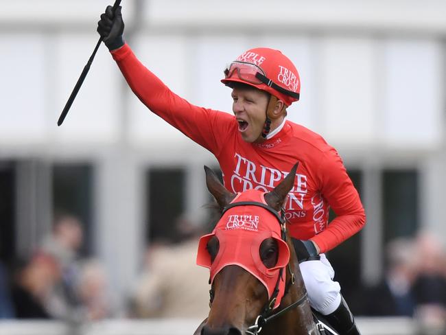 Jockey Kerrin McEvoy on Redzel gestures to the crowd after winning The TAB Everest race during The TAB Everest race day at Royal Randwick Race Course, in Sydney, Saturday, October 14, 2017. (AAP Image/David Moir) NO ARCHIVING, EDITORIAL USE ONLY