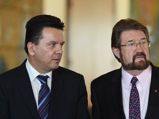 Nick Xenophon Team Senator Nick Xenophon (left) and Justice Party Seator Derryn Hinch speak to the media during a press conference at Parliament House in Canberra, Tuesday, Nov. 22, 2016. It's taken several years and a double-dissolution election but the Senate has finally passed the Turnbull government's registered organisations bill after a late-night debate. Senators Xenophon and Hinch insisted they'd secured what could be the best whistleblower protections in the world in exchange for their support for the bill to establish a Registered Organisations Commission to oversee unions and their officials. (AAP Image/Lukas Coch) NO ARCHIVING