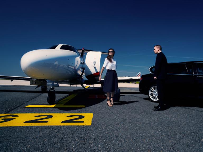 A private car takes guests from the lounge to their plane at Air France.