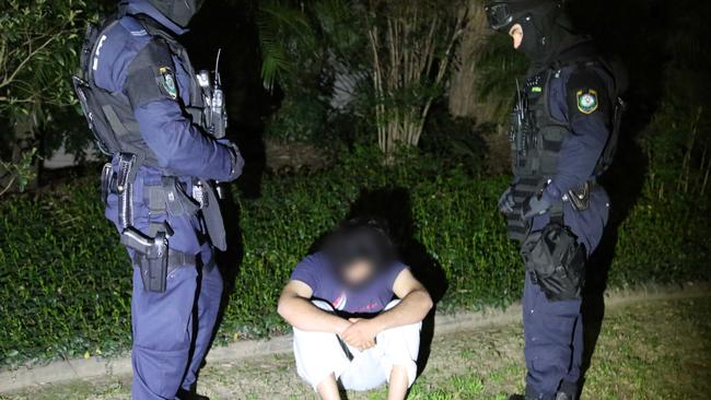 A man is arrested during terror raids in Sydney last week. Pic: NSW Police