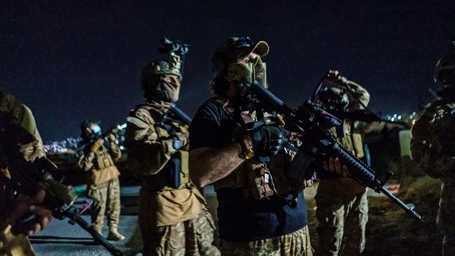 Taliban fighters wielding American weapons storm into the Kabul International Airport after the US military completed their withdrawal from Afghanistan. Picture: Getty Images