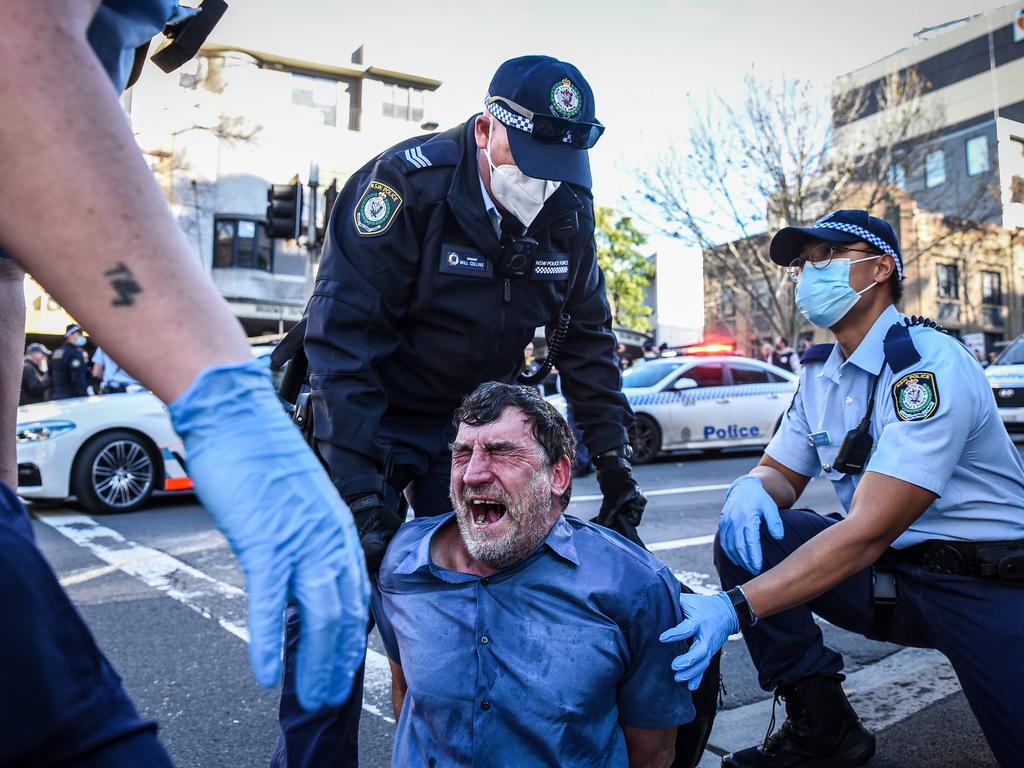 Protesters are arrested by police officers in Sydney. Picture: Flavio Brancaleone/NCA NewsWire