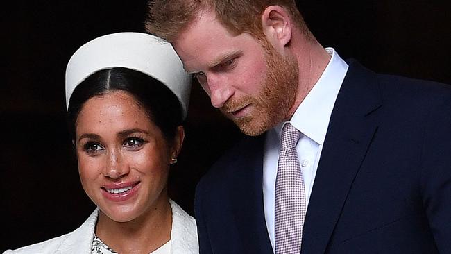 (FILES) In this file photo taken on March 11, 2019 Britain's Prince Harry, Duke of Sussex (R) and Meghan, Duchess of Sussex leave after attending a Commonwealth Day Service at Westminster Abbey in central London. - Prince Harry will produce a documentary about the Invictus Games for disabled military veterans -- the first series under a lucrative deal he and  wife Meghan Markle signed with Netflix after moving to California last year.  Harry, who served with the British military in Afghanistan, will appear on camera and executive-produce "Heart of Invictus," a multi-episode series which follows competitors as they train for next spring's competition in The Hague. (Photo by Ben STANSALL / AFP)