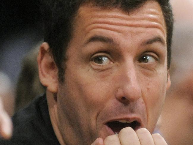 Actor Adam Sandler watches the Los Angeles Lakers and Boston Celtics during the second half of an NBA basketball game in Los Angeles, Sunday, Jan. 30, 2011. The Celtics won 109-96. (AP Photo/Chris Carlson)