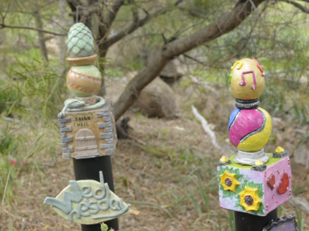 Happy Chat participants 'Totems of Hope' sit high among the fields at Whistle Stop Community Gardens.