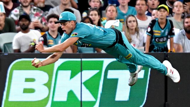 Brisbane Heat’s Ben Laughlin takes a spectacular catch to dismiss the Strikers’ Michael Neser in the Big Bash League Eliminator at The Gabba. Picture: Getty Images