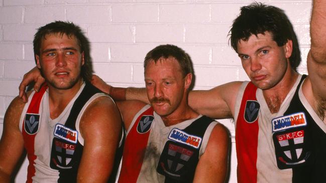 Danny Frawley (R), Geoff Cunningham and Tony Lockett (L) of the St Kilda Saints relax in the rooms after the 1989 VFL match.