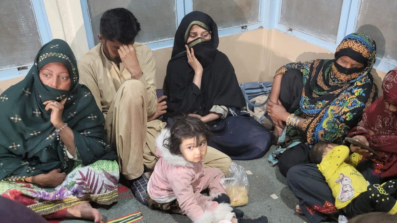 Freed train passengers following a security operation against armed militants who ambushed the train in Balochistan. Picture: Banaras Khan / AFP