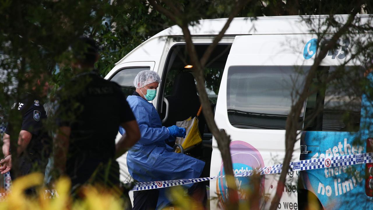 A police forensic officer inspects the minibus in Cairns. Picture: Brendan Radke