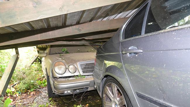 Cars crushed by a smashed carport on Hadleigh Rise in Upper Sturt. Picture: Brenton Edwards