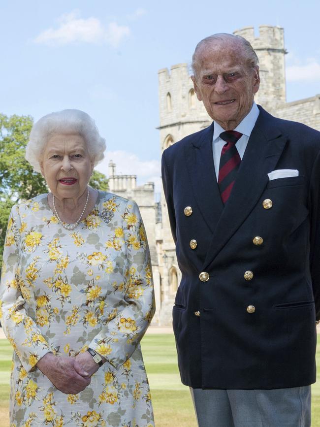 Queen Elizabeth II and Prince Philip in the quadrangle of Windsor Castle ahead of his birthday. The Queen is wearing an Angela Kelly dress with the Cullinan V diamond brooch, while Prince Philip is wearing a Household Division tie. Picture: Steve Parsons/Pool via AP