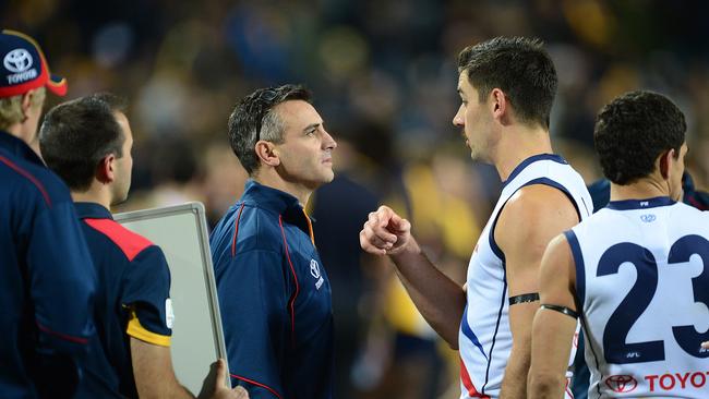 Scott Camporeale talks with captain Taylor Walker during his stint as interim Crows coach in 2015. Picture: Mark Brake