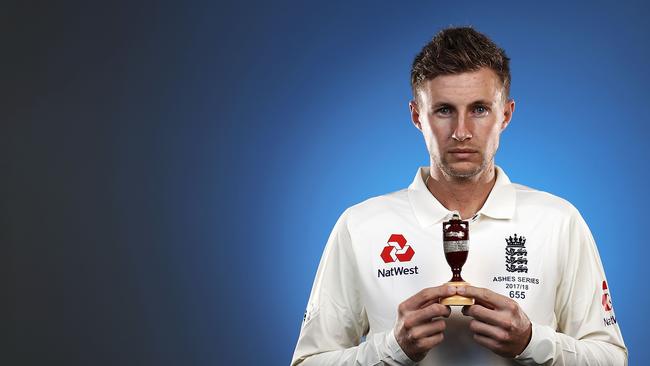 Joe Root poses with the Ashes.