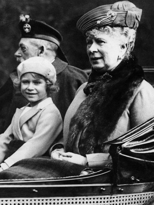 Princess Elizabeth with her grandparents King George V and Queen Mary on the way back to Balmoral after attending church in 1932. Picture: Getty Images.