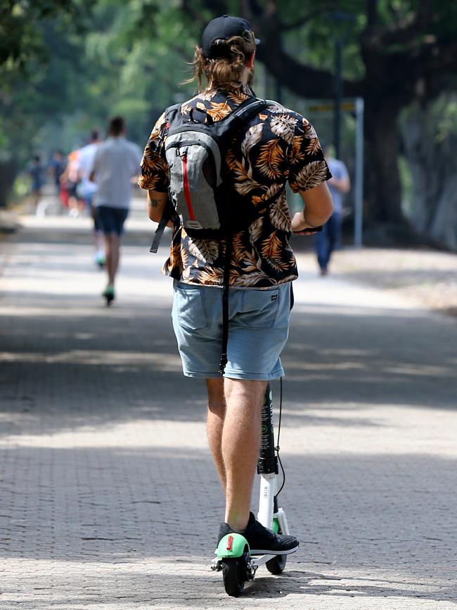 A man uses a Lime e-scooter in Brisbane. Picture AAP / David Clark