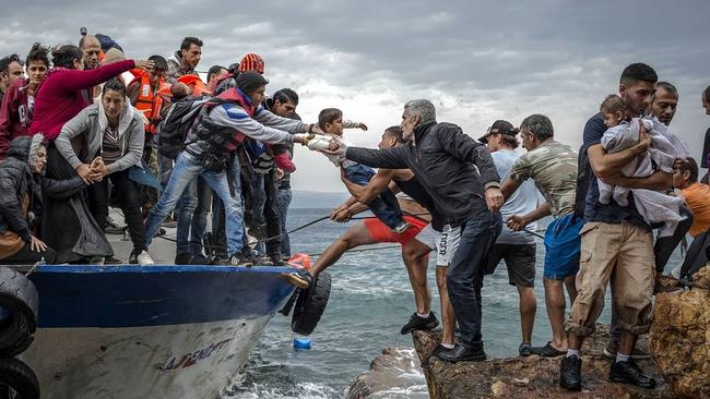 A group of refugees land on Lesbos, Greece. (Pic: Antonio Masiello/Zuma Press)