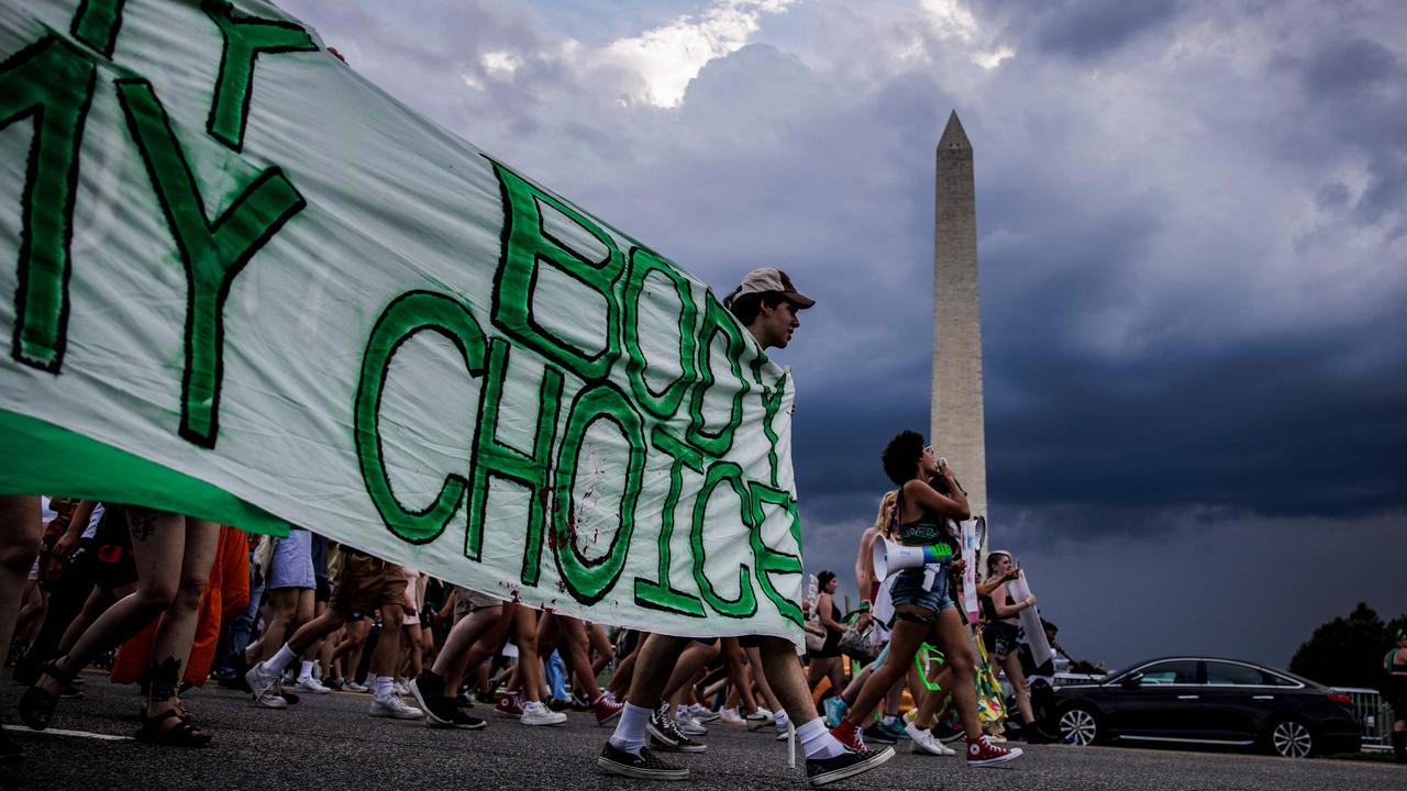 Abortion rights activists march past the Washington Monument on June 26, 2022, two days after the US Supreme Court scrapped constitutional protections for the procedure. Picture: Samuel Corum/AFP