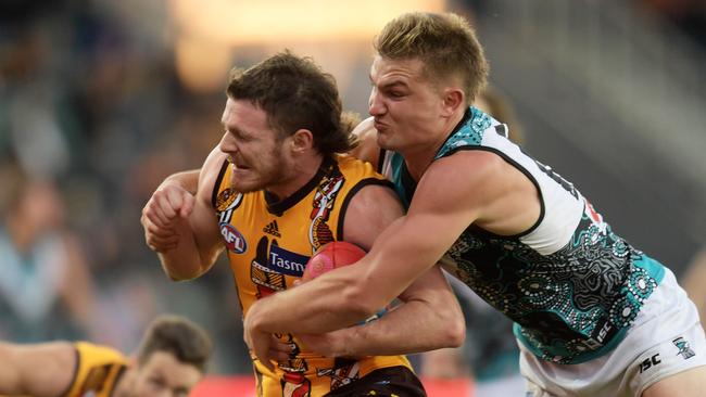 Ollie Wines of the Power tackles Blake Hardwick of the Hawks during the Round 11 AFL match between the Hawthorn Hawks and the Port Adelaide Power at the University of Tasmania Stadium in Launceston, Saturday, June 2, 2018. (AAP Image/Tracey Nearmy) NO ARCHIVING, EDITORIAL USE ONLY