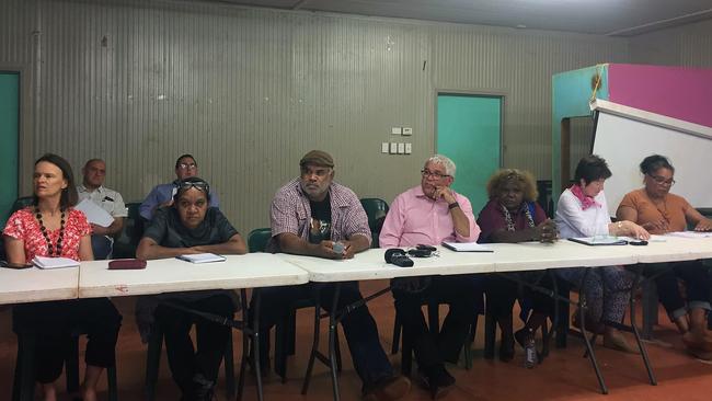 Commissioners Mick Gooda (fourth from right) and Margaret White (second right) attend a community meeting for the Royal Commission into the Protection and Detention of Children in the Northern Territory in Mutitjulu on October 27. Picture: Lucy Hughes Jones / AAP