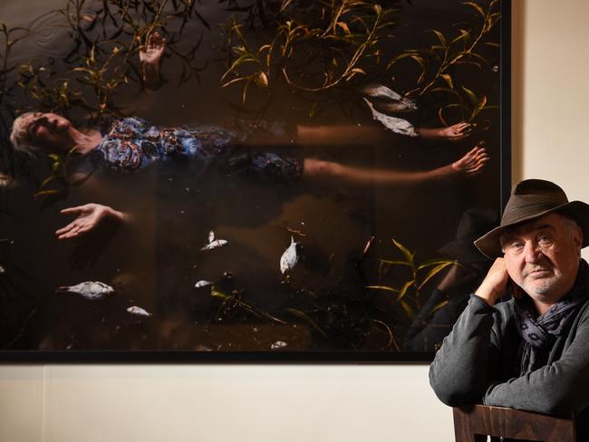 Curator Gavin Wilson with Melissa Williams-Brown’s photo of Sydney performance and environmental artist Bonita Ely which is on show at the S.H. Ervin Gallery. Picture: Flavio Brancaleone