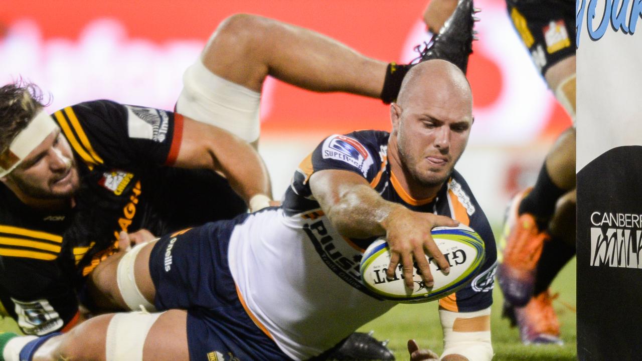 Locky McCaffrey of the Brumbies scores a try at GIO Stadium in Canberra.