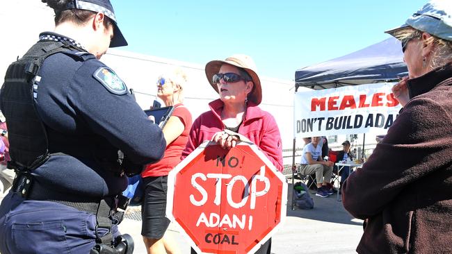 Protesters block trucks leaving the industrial site of an Adani contractor. (AAP image, John Gass)