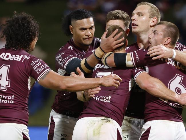 SUNSHINE COAST, AUSTRALIA - AUGUST 14: Tom Trbojevic of the Sea Eagles celebrates scoring a try with his teammates during the round 22 NRL match between the Manly Sea Eagles and the Parramatta Eels at Sunshine Coast Stadium, on August 14, 2021, in Sunshine Coast, Australia. (Photo by Glenn Hunt/Getty Images)