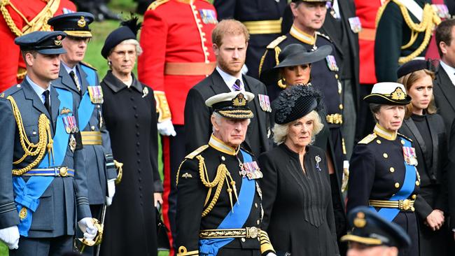 Then Prince Charles with his wife Camilla, sons William and Harry and sister Anne observe the coffin of Queen Elizabeth II as it is transferred from the gun carriage to the hearse at Wellington Arch following her state funeral. Picture: WPA Pool/Getty Images.