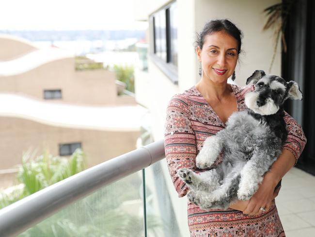 Angus the pooch, the designer tower and the $100,000 court case. Angus and his owner, Jo Cooper, at the Horizon Building in Darlinghurst. Picture: Rohan Kelly