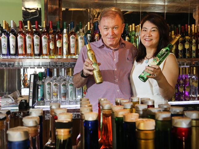 Gordon Chalmers and Shumei Hou have just bought the beloved Tamborine Mountain Distillery. The two look over the tasting room after the sale. . Picture Glenn Hampson