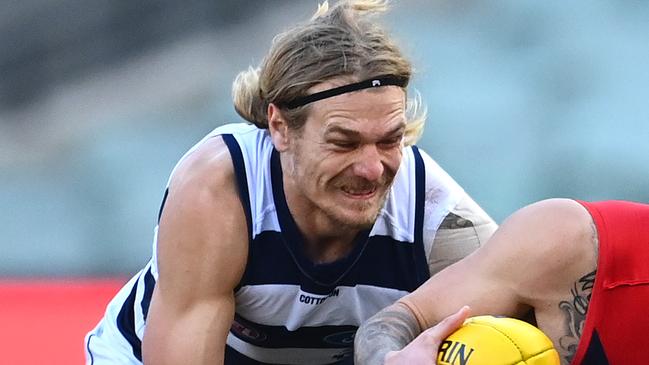 Gun Geelong defender Tom Stewart was left injured after a clash with Demon Tom McDonald. Picture: Getty Images