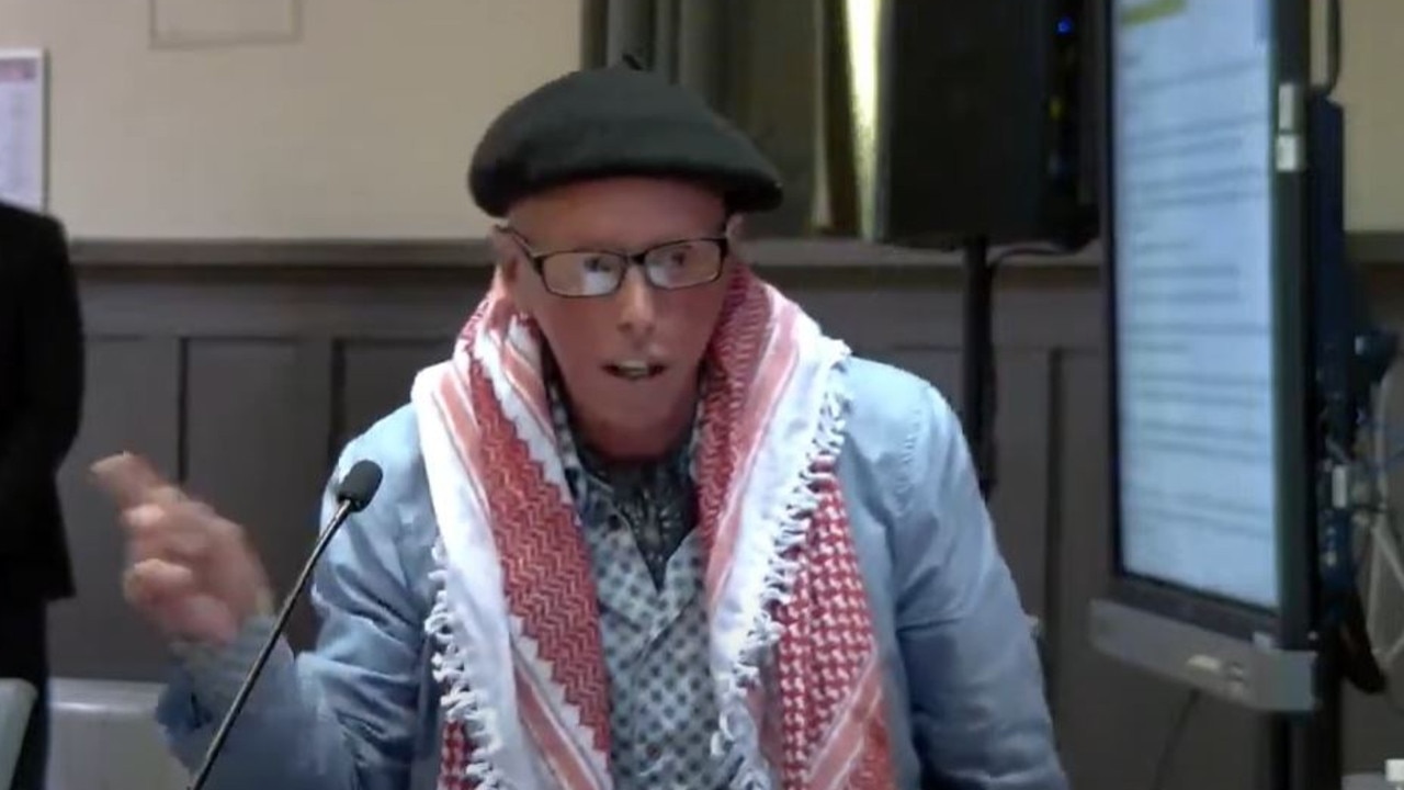 Darebin councillor Gaetano Greco, wearing a keffiyeh, at the December 18 council meeting.