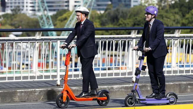 Lord Mayor Adrian Schrinner, left, and Brisbane city Councillor Ryan Murphy with new electric scooters in 2021. Picture: Josh Woning