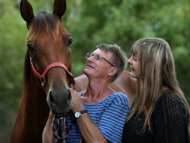 Trainer Ken Rattray with Destreos and his wife Sally, who owns the amazing pacer. Picture: Adam Head