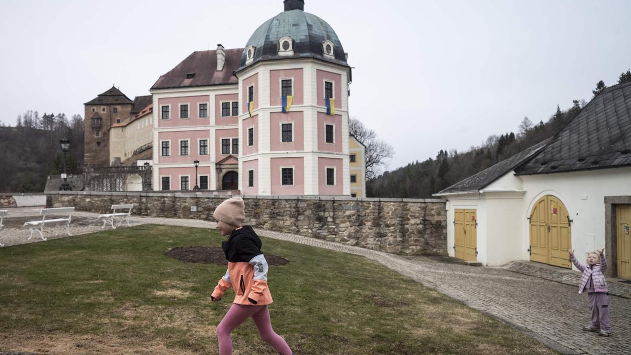 Ukrainian children play in a yard at the Becov nad Teplou castle. Picture: Michal Cizek/AFP