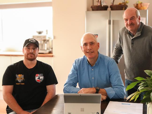 Energy and Renewables Minister Nick Duigan is joined by Liberal member Mark Shelton and homeowner Nic Collar, as the Renewable Energy Dividend hits the energy accounts of every Tasmanian household and small business. Picture: Stephanie Dalton