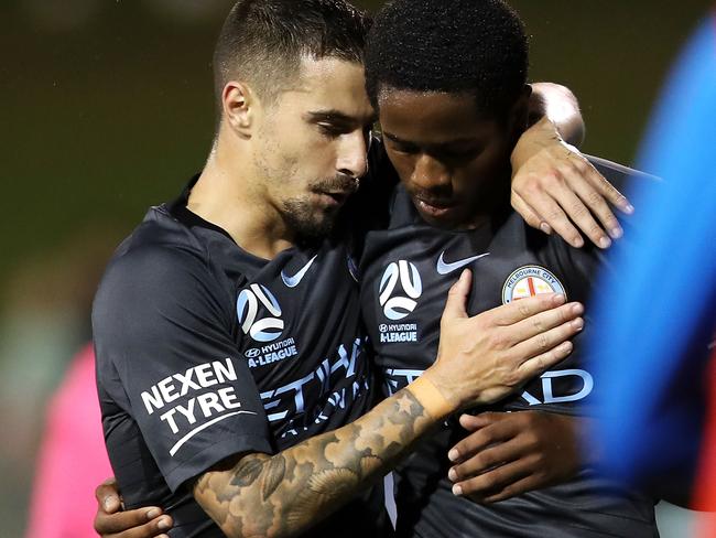 Jamie Maclaren congratulates Shayon Harrison after he scored against Sydney FC.