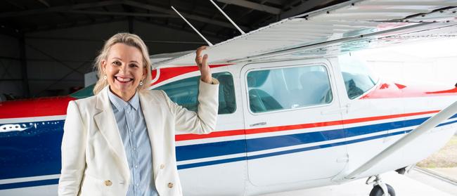 Sussan Ley with the first plane she flew at Albury Airport. Picture: Simon Dallinger